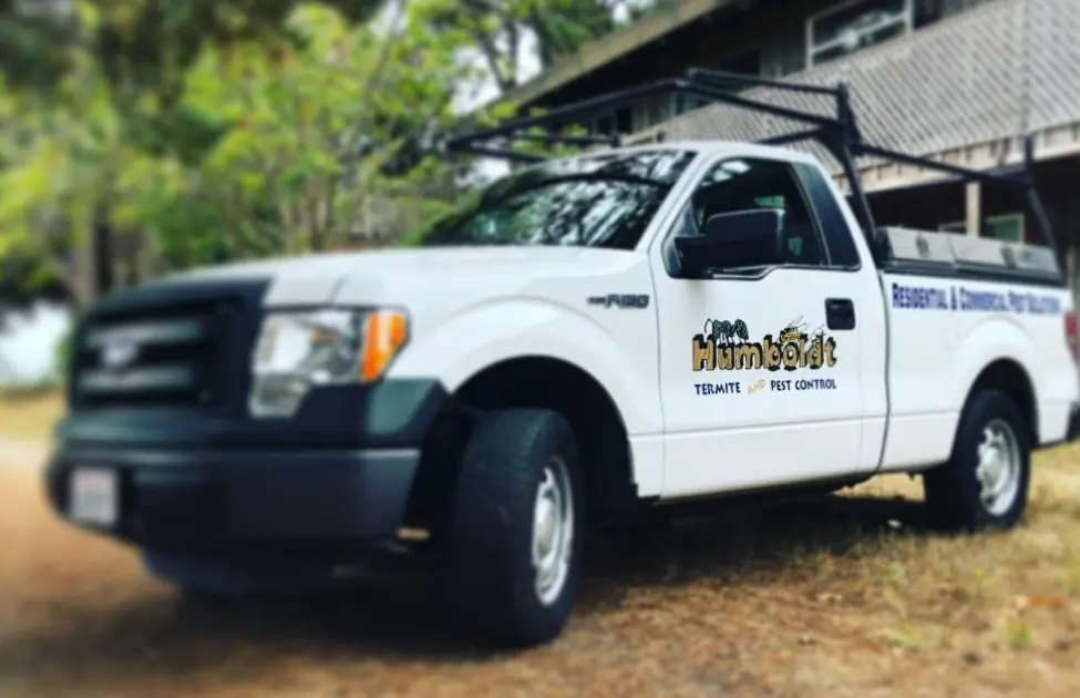 Humboldt Termite & Pest Control Service truck parked in front of a home in Arcata before pest application