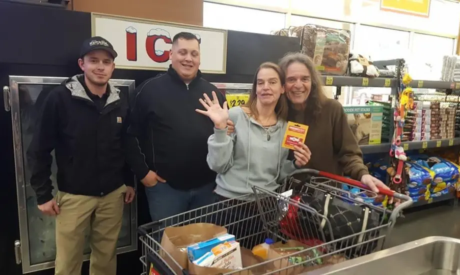 Volunteers at Humboldt Termite & Pest Control standing with Groceries for Good participants in Mckinleyville Grocery Outlet.